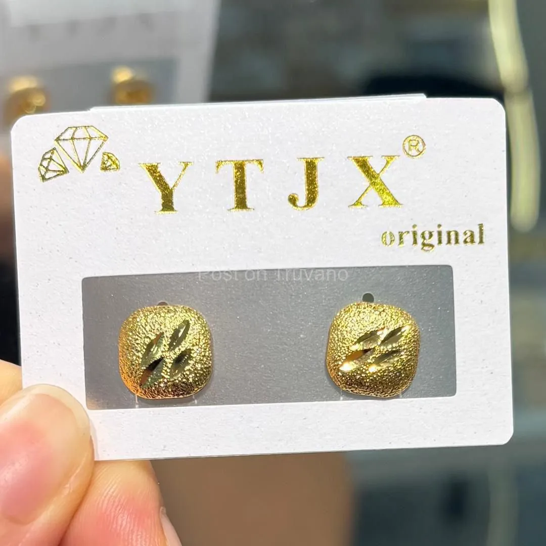 These YTJX earrings feature a pentagonal design with a textured, sparkling finish.